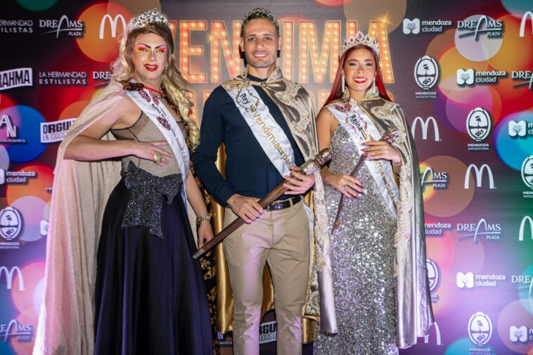 Three pageant winners pose in elegant attire with crowns and sashes at a vibrant event.