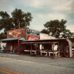 Charming small-town Georgia storefront with vintage signs and rustic appeal.