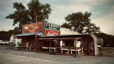 Charming small-town Georgia storefront with vintage signs and rustic appeal.