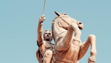 Majestic statue of a warrior on horseback in Skopje, symbolizing strength and history.
