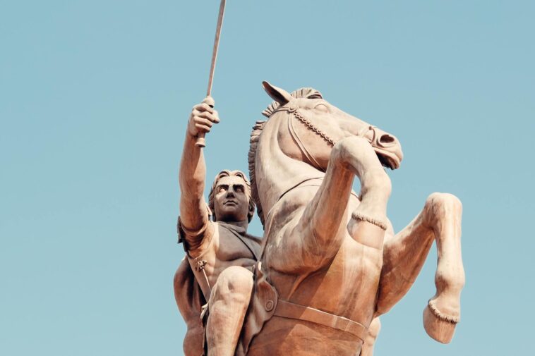 Majestic statue of a warrior on horseback in Skopje, symbolizing strength and history.