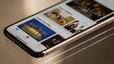 Close-up view of a smartphone featuring a streaming service interface, highlighting technology in modern entertainment.