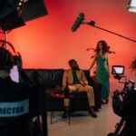 A dynamic film set with actors and crew actively engaged in a studio environment.