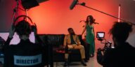 A dynamic film set with actors and crew actively engaged in a studio environment.