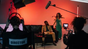 A dynamic film set with actors and crew actively engaged in a studio environment.