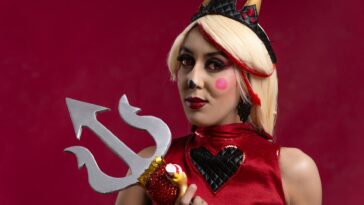 A vibrant cosplay portrait featuring artistic makeup and a trident, shot in Mexico City.