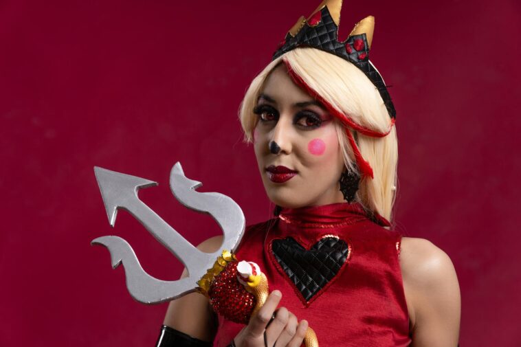 A vibrant cosplay portrait featuring artistic makeup and a trident, shot in Mexico City.