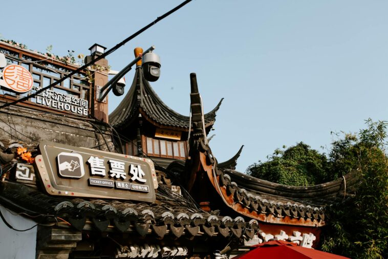 Capture of traditional Chinese rooftop with signage in Nanjing, China.
