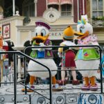 Vibrant Disney characters in a parade at Disneyland Paris, capturing festive spirit.