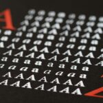 Close-up image showcasing various styles of the letter A in print, emphasizing typography diversity.