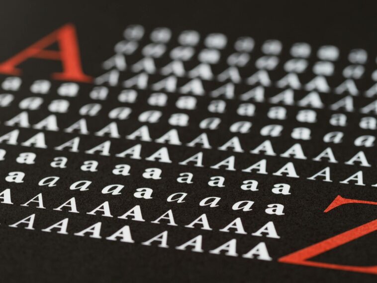 Close-up image showcasing various styles of the letter A in print, emphasizing typography diversity.