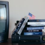 A nostalgic scene with VHS tapes, a vintage TV, and a small American flag.