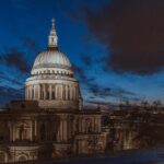 Beautiful nighttime cityscape featuring St. Paul's Cathedral in London with an illuminated skyline.