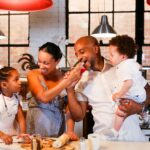 Family enjoying quality time cooking and having fun in the kitchen.