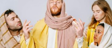 Four individuals portray biblical figures in traditional attire, emphasizing spirituality and role play.