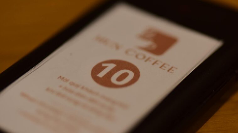 A close-up shot of a paper number sign on a table at a cafe. Ideal for restaurant themes.