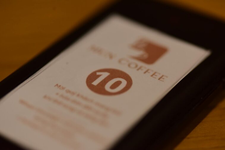 A close-up shot of a paper number sign on a table at a cafe. Ideal for restaurant themes.